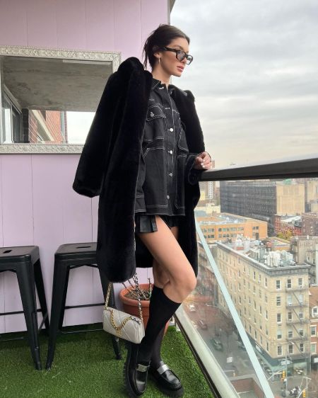 Model Bella Banos on her full black dress.